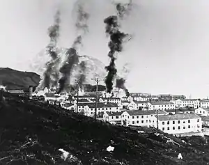 Buildings burning after the first Japanese attack, 3 June 1942.