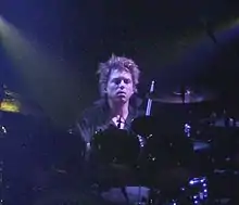 Cooper performing with The Cure in 2008