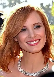 Chastain smiling at the camera