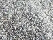 A closeup photograph of salt growths on the crust of a dry lake.