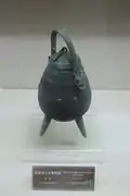 Bronze you tripod with zoomorphic image