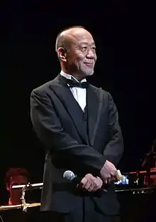 Joe Hisaishi at a 2011 concert