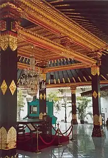 Building interior, with square wood pillars