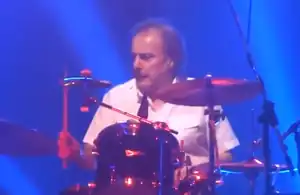 Coghlan in 2013, performing withStatus Quo in Manchester