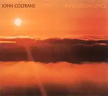 An orange photo of the sun above the clouds with "JOHN COLTRANE" written in brown and "INTERSTELLAR SPACE" written in orange at the top.