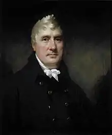 Portrait of man with white hair wearing a white cravat and blue jacket.