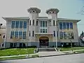 An extremely similar design was used for a number of schools, the last of which was the Latona School (built 1906), now John Stanford International School, a bilingual orientation center.