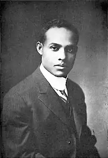 Black and white photograph of Davis as a young man in a suit and tie