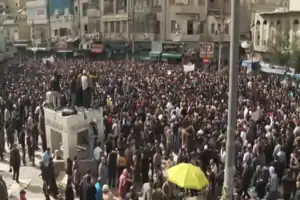 Large street demonstration, with speakers addressing the crowd