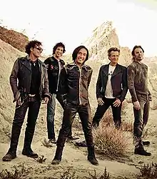 Journey in 2013 from left to right: 

Neal Schon, Deen Castronovo, Arnel Pineda, Ross Valory, Jonathan Cain