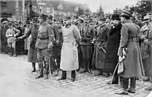 A crowd of men wearing military uniforms