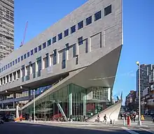 A picture of the Alice Tully Hall building at the Juilliard School in New York City, taken from across the street