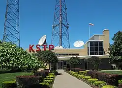 Entrance to the KSTP-AM-FM-TV studios on University Avenue.  The sidewalk leading to the building lies precisely on the city line, as does the central leg of the tower.