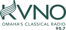 All in a dark green: The letters KVNO in a sans serif on top, with the upward stroke of the K changed to a curling music staff. Beneath are the words "Omaha Classical Radio" and "90.7".