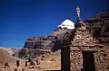 Monuments and Mount Kailash near the lake