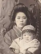 Kane Tanaka holding her younger brother Nobuo Tanaka in the 1920's