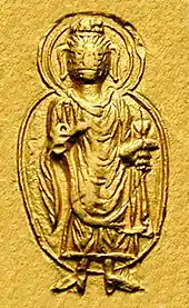 127-150 CEThe Buddha in Gandhara style on a coin of Kanishka I