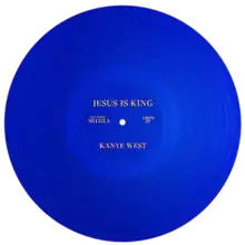 A blue LP vinyl with yellow lettering of the "Jesus Is King" album.