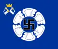 The colour of the Karelian Air Command features, like all Finnish Air Force colours, a swastika within a winged circle. The identifying device is a small coat of arms of Karelia