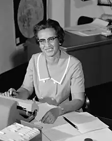 Photograph of Johnson sitting at a desk