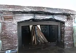 Fireplace in the Kehlsteinhaus, a present from Mussolini (The three central stones were chipped by Allied souvenir hunters.)