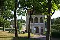 Kelmė Manor gates and church in the distance