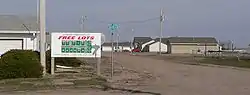 Sign promoting Kenesaw Homestead Act at subdivision entrance, March 2010