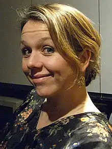 close-up of Kerry Godliman from profile, smiling at camera