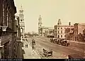 C. 1869-1889. Town Hall on left, Post Office on right.