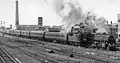 Special 'Illuminations' Express to Blackpool, 1962, with Wesham's Phoenix Mill in the background.