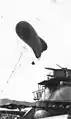 Kytoon equipped ship. US Navy photo. A kite balloon has been deployed from the USS Arizona. The kite balloon has a two-man crew.