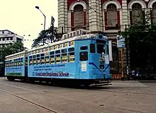 A vintage tram moving through the streets