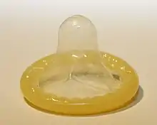 A rolled up male condom.