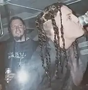 Danny Hamilton looking to Brian Welch drinking a beer