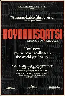 A black film poster with a dark gray background pattern resembling a circuit board.  "KOYAANISQATSI" appears in large red text, with "LIFE OUT OF BALANCE" beneath in small white text.  The poster also includes the quote "Until now, you've never really seen the world you live in" and "A remarkable film event" in addition to filmmaker credits listed throughout.