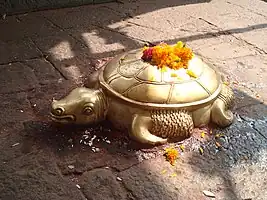 Brass sculpture of a tortoise.