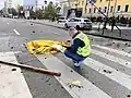 A dead civilian under a blanket after a missile attack on Kyiv city centre on October 10, 2022