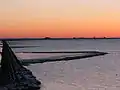 Evening view of the islet with its four wharfs and the Lorendamm, seen from the mainland