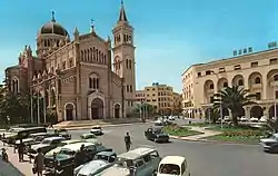 The old Tripoli Cathedral (now a mosque) and the former FIAT center (Algeria Square) during the 1960s