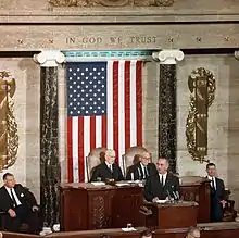 Hayden seated to the left of John W. McCormick during a 1963 speech by President Lyndon B. Johnson to a joint session of Congress