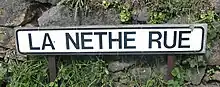 Road sign in La Néthe Rue (the black road in Jèrriais)