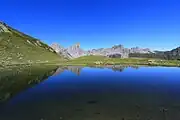 Aiguilles d'Ansabère and Mesa de los Tres Reyes reflected in the lake of Ansabère