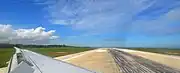 The wing view from an Airbus A320 backtracking at the end of runway 09.