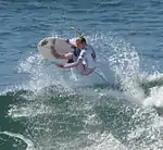 Professional surfer Lakey Peterson competing at the 2011 U.S. Open of Surfing