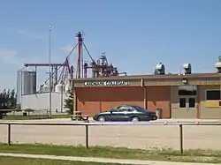 Landmark high school with Landmark Feeds in the background