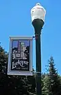 street banner celebrating the 100th anniversary of Larkspur