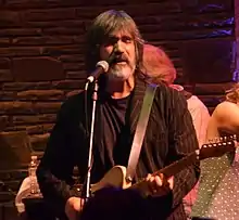 Larry Campbell plays guitar, mandolin, bass, violin and bouzouki