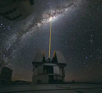 View of the Milky Way and the Great Rift from ESO's Very Large Telescope in Cerro Paranal, Chile.  The laser beam points almost directly toward the Pipe Nebula.