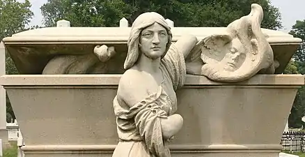 Sculpture on William Warner memorial by Alexander Milne Calder depicting a woman releasing a soul from a sarcophagus