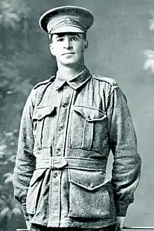 a black and white 3/4 portrait of a male in uniform